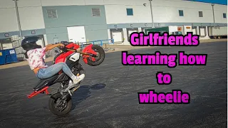 My girlfriend is learning how to wheelie!