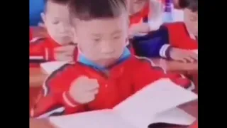 Chinese/Asian/Mongolian boy speed (or rather spiritual) reading a book