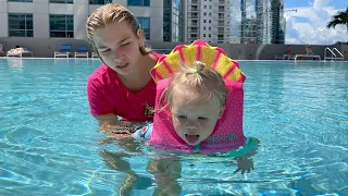 Maggie teaches Naomi how to swim in the pool!