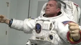 Wearing space suit no easy task