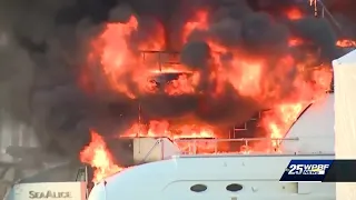 Fire crews monitoring hot spots on yacht