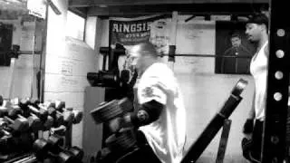 SHOULDER PRESSING 105 POUND DUMBELLS