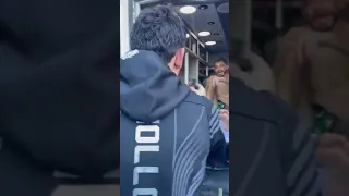 Max Holloway greets Yair Rodriguez in his ambulance