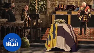 Prince Philip's coffin is lowered through the chapel floor