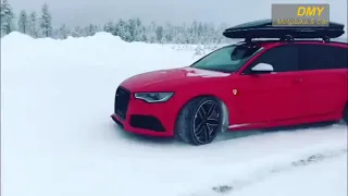 Beautyfull Red Audi RS6 wagon/estate drifting on the snow
