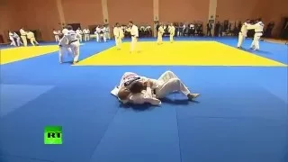 Mixed judo woman sparring Vladimir Putin