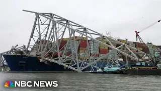 Workers create narrow channel through destroyed Baltimore bridge