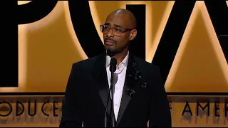 PGA Awards: Charles D. King accepts the Milestone Award from Ryan Coogler