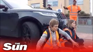 Furious motorist in drives into Insulate Britain protesters