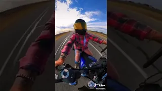 Biker girl out on a ride on her Harley-Davidson dyna motorcycle