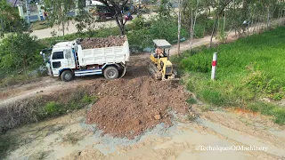 The Start New Project Processing By Bulldozer Pushing Soil And Dump Trucks Unloading Land