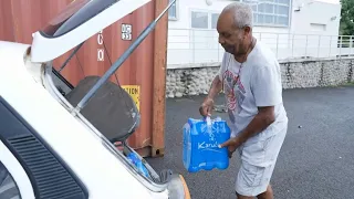 Coupures d'eau en Guadeloupe: des mairies distribuent de l'eau | AFP