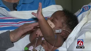 Woman cuddles babies born addicted to drugs