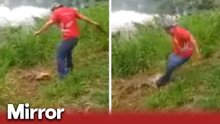 Crocodile tries to drag man into lagoon