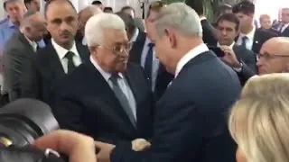 Abbas, Netanyahu shake hands at Shimon Peres' funera...
