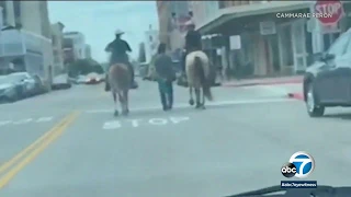 Texas officers on horseback seen leading handcuffed man with rope | ABC7