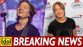 Keith Urban shows off his bulging biceps and rockstar tattoos in a tight black T shirt as he perform