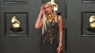 Dua Lipa Grammy 2022 in Versace 1992 and Bulgari on april 3, 2022