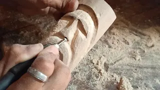 Carving a wood spirit with Dremel.