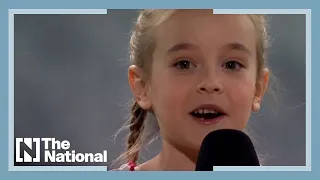 Girl from viral 'Frozen' video sings Ukrainian anthem at charity concert