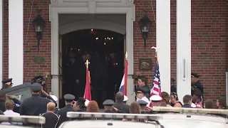 Officer Michael Langsdorf's casket leaves Hoffmeister Mortuary