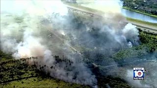 Crews battle grass fire in southwest Miami-Dade