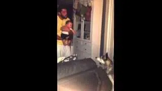 Baby laughing at husky howling