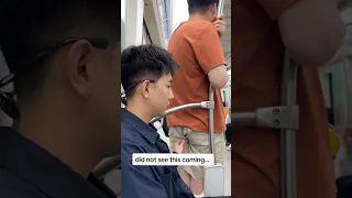 Chinese dude awkwardly tries to hold in a fart on a train full of people...