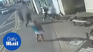 Moment man is violently hit in face with hammer outside pub