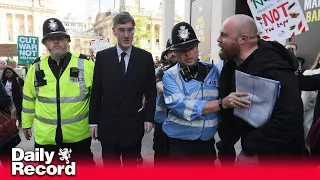 Jacob Rees-Mogg chased and booed by protesters outside Tory party conference