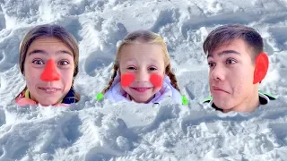 Nastya and friends play with snow and sculpt a snowman