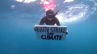 Mauritian climate activist holds underwater protest