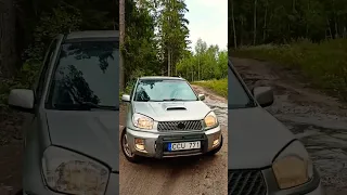 Toyota RAV4, light offroad, puddle in the forest