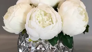 Faux peonies in vase