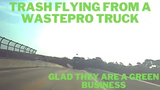 Trash flying out of a WastePro truck on 415 in Daytona Beach crossing I-95 1:15pm Saturday Dec 3rd