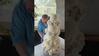 Assembling Four Tiered Buttercream Wedding Cake with Handmade Gumpaste Roses on site!