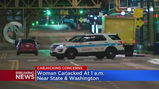 Woman carjacked while stopped at red light in The Loop