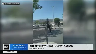 Robber drags woman across parking lot in vicious purse snatching