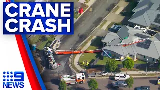 Crane slams into Queensland family home after truck topples | 9 News Australia