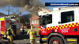 Fire fighters rescue a man after house fire in Dover Heights NSW