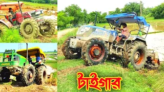 While the tractor is lifting the mud from the land to the embankment Tractor Video