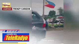 Matandang lalaki, hinangaan matapos itayo at saluduhan ang natumbang watawat ng PH | TeleRadyo