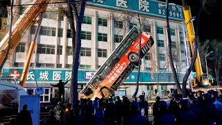 Sinkhole swallows bus leaving 80 square foot pit in Chinese road