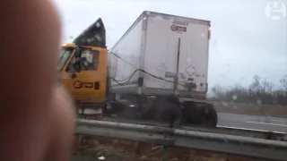 Truck crashes after it jack-knifes on black ice in New Jersey