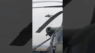 Russian Soldier Hangs From A Helicopter When His Parachute Got Stuck While Jumping At 6,500 Feet