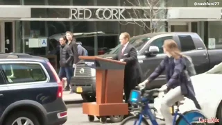 Melissa McCarthy as Sean Spicer drives podium on NYC streets