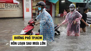 Nước ngập chảy xiết như thác, đường phố TP.HCM hỗn loạn sau mưa lớn