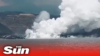 La Palma: Drone footage shows huge steaming headland formed by lava