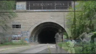 Abandoned Pennsylvania Turnpike Sideling hill tunnel walk through with 1940's music.