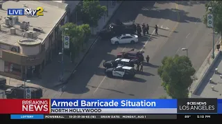 An armed suspect wanted for 9 felonies is barricaded in North Hollywood.